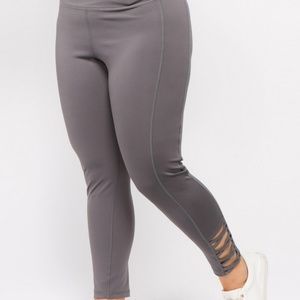 NWT Active leggings with criss cross bottom.